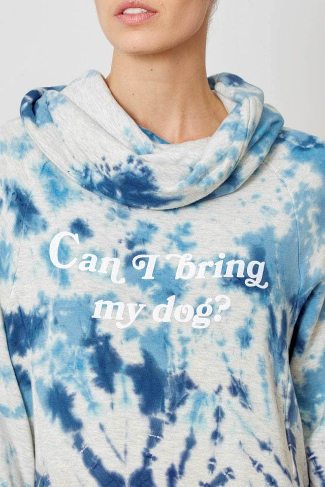 light and dark blue tie dye cowl neck sweatshirt with pockets and Can I bring my dog? graphic printed in white ink across the chest
