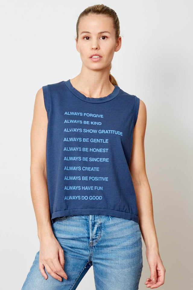 model is wearing a navy, cropped tank top with Always graphic printed in a light blue ink