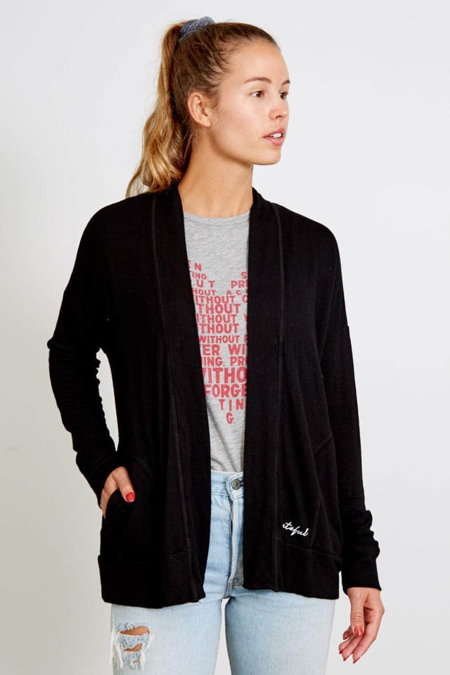 black shawl collar cardigan with pockets and grateful printed in cursive on front left pocket