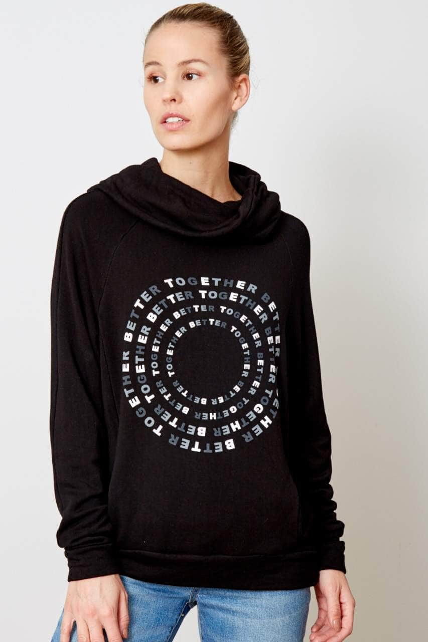 black cowl neck sweatshirt with "better together" graphic of 4 grading circles is printed on the front in alternating ink colors of white, light grey, and dark grey