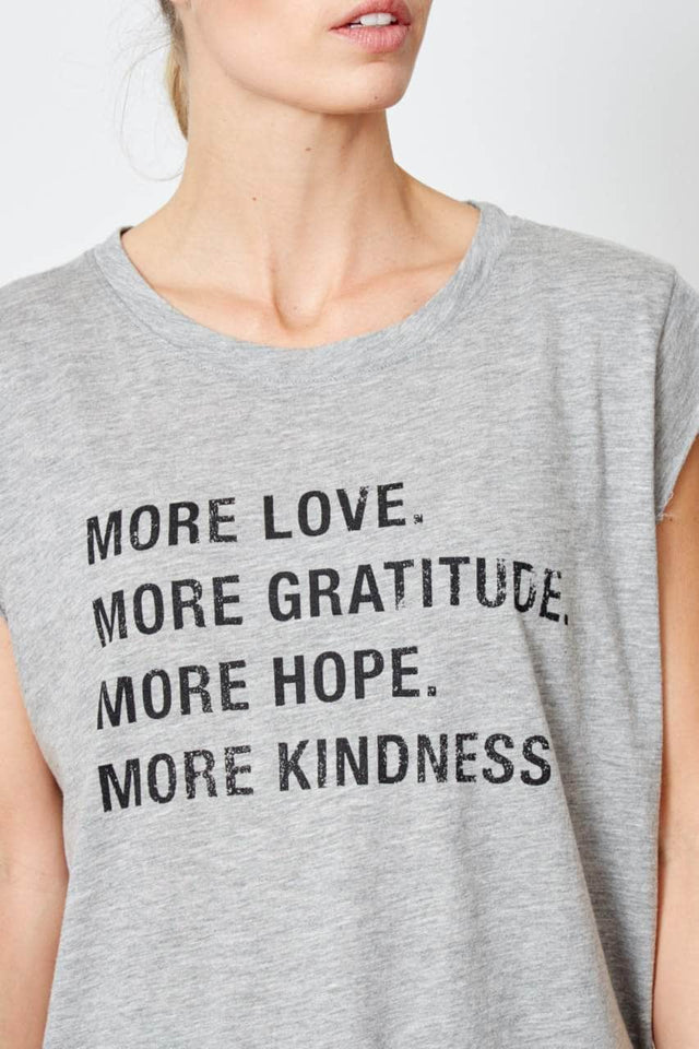 heather gray, oversized, cap sleeve t-shirt with "More Love. More Gratitude. More Hope. More Kindness." printed on the chest in black ink