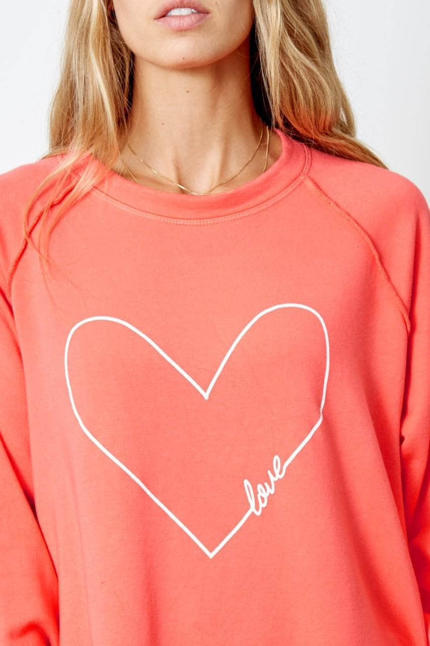 the word love has been worked in to heart outline and is printed on the front of the sweatshirt in white ink